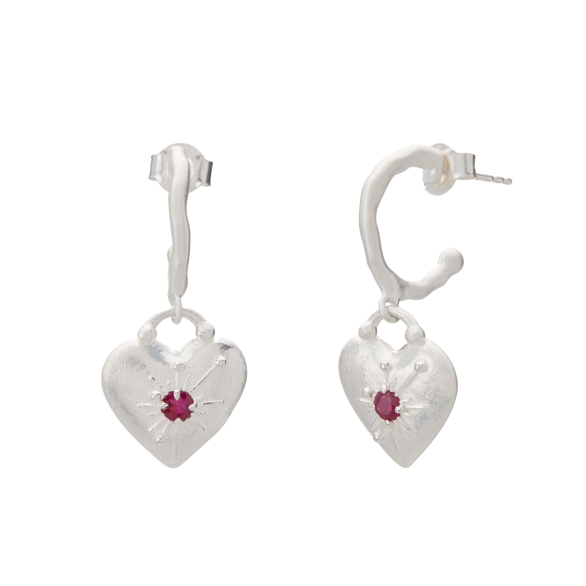 Heart-shaped earrings with red gemstones on a white background